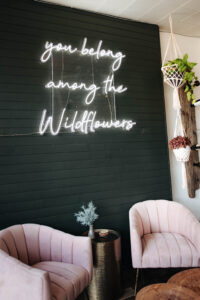 wolf and wildflower sign